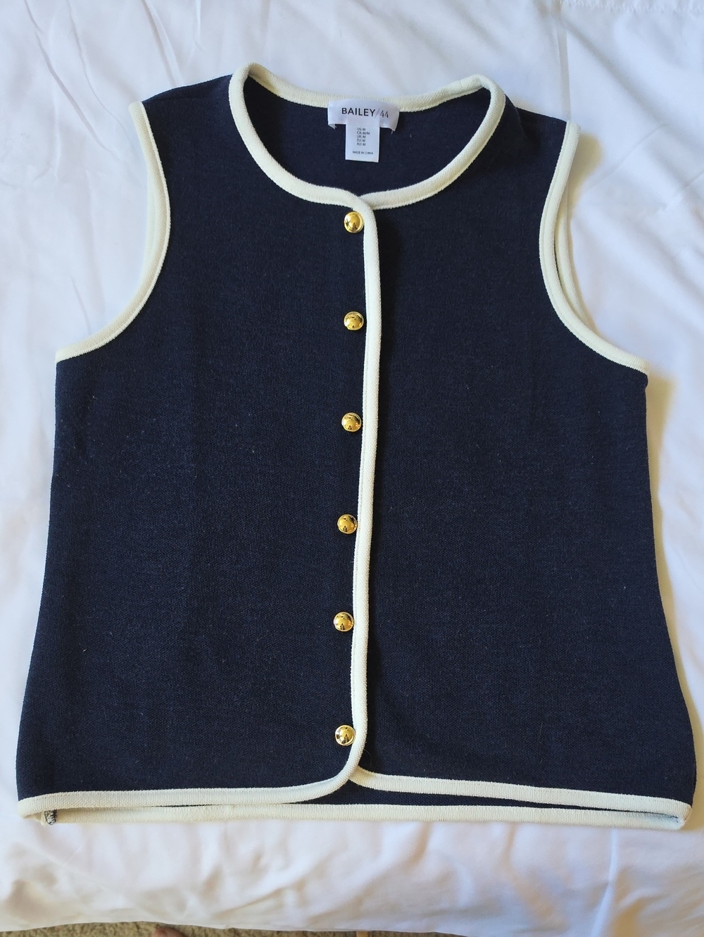Bailey 44 Navy Knit Sleeveless Top with Cream Trim and Gold Buttons.